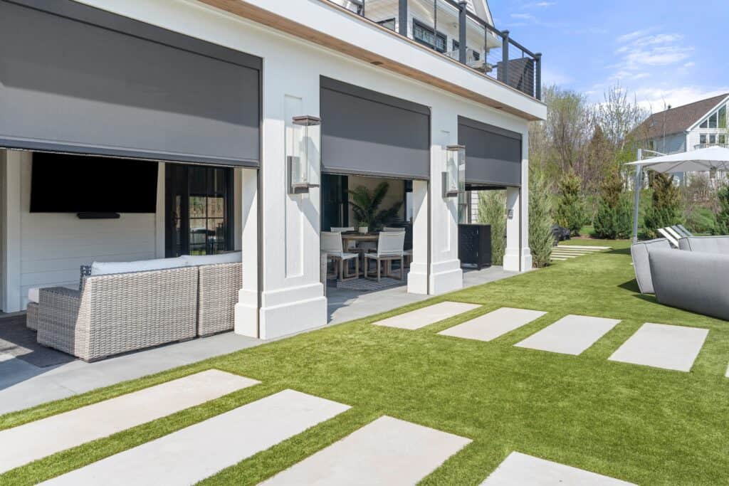 A backyard with a patio.