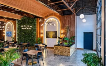 The interior of a restaurant with tables and chairs.