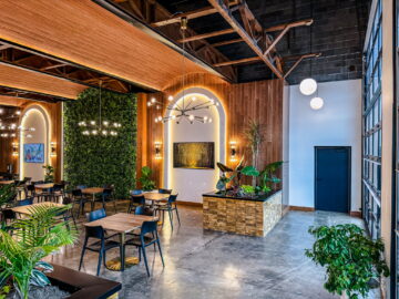 The interior of a restaurant with tables and chairs.