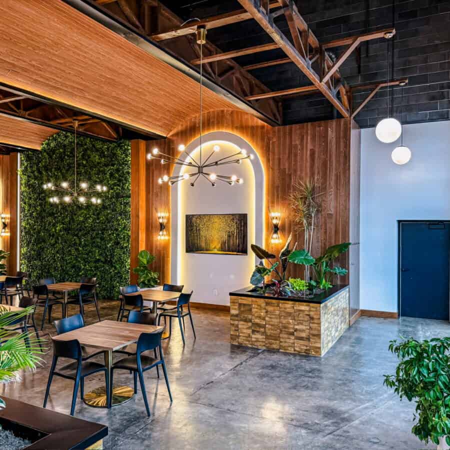 The interior of a restaurant with tables and chairs.
